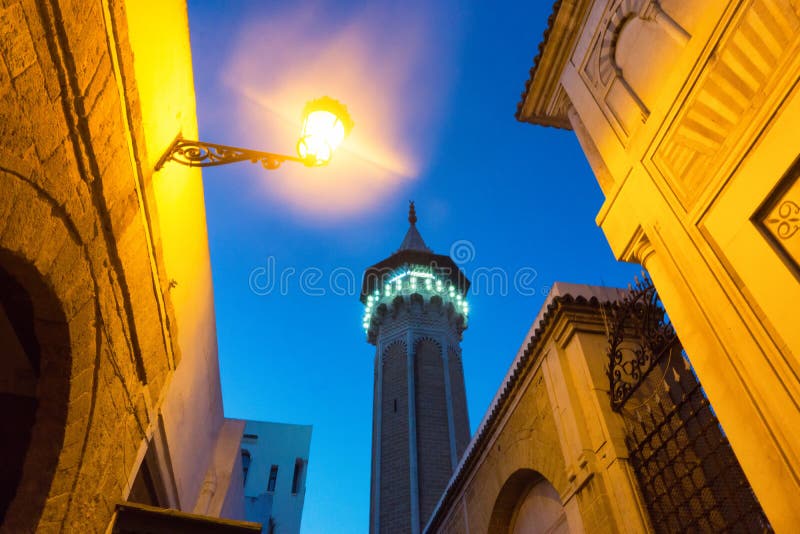 View of mosque minaret and buildings at blue hour in Tunis, Tunisia. View of mosque minaret and buildings at blue hour in Tunis, Tunisia