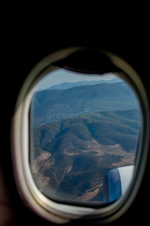 View of the mountains from the plane window. View from a height. Earth and sky through the airplane window. Airplane height stock images, royalty-free photos and pictures