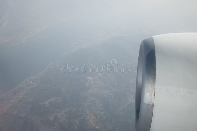 View of the mountains from the plane window. View from a height. Earth and sky through the airplane window. Airplane height stock images, royalty-free photos and pictures