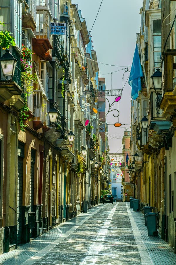 View of a Narrow Street in Spanish City Cadiz...IMAGE Editorial Stock