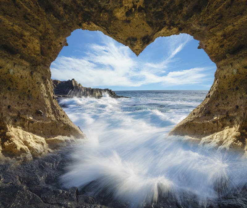 View of the ocean from a heart-shaped cave-symbol of love and Valentine`s Day