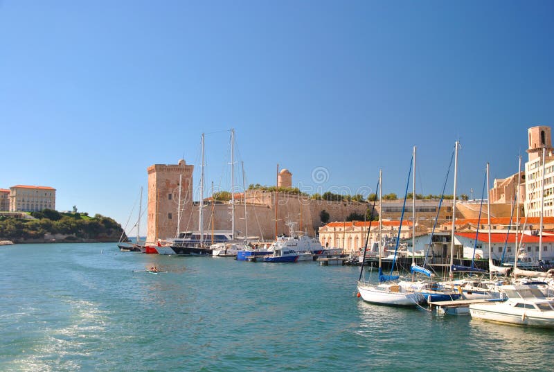 View of the old harbor of Marseille with modern apartment buildings, many yachts and sailing boats