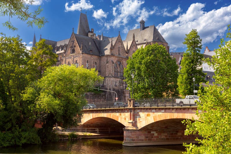 Stone facade of the old medieval university in Marburg on a sunny morning. Germany. Stone facade of the old medieval university in Marburg on a sunny morning. Germany.