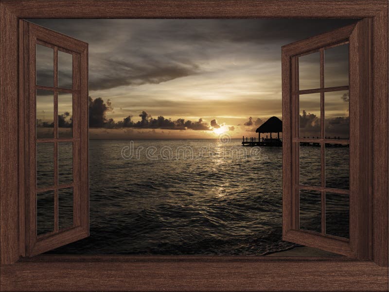 View from the open window at the sea sunset