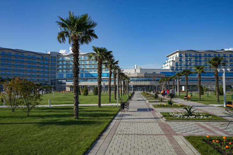 View of the outdoor swimming pool with clear water in the territory of Sochi Hotel Park. royalty free stock photos View of the outdoor swimming pool with clear water in the territory of Sochi Hotel Park. royalty free stock photos