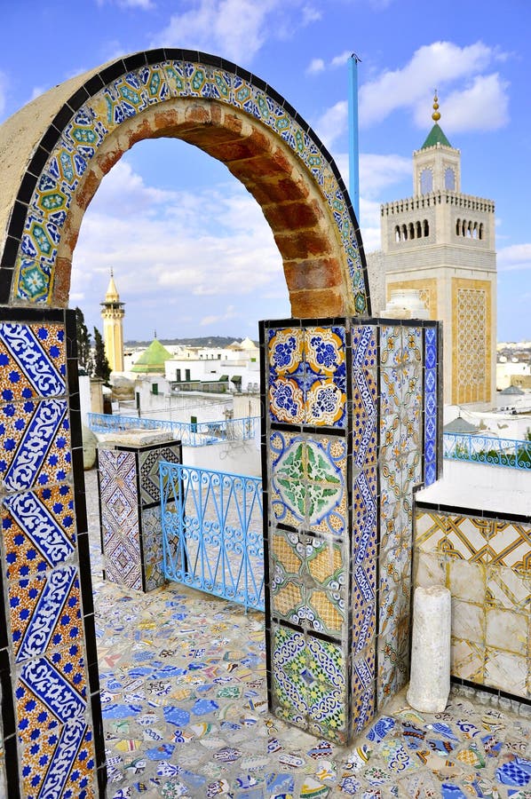 Amazing view from the rooftop arcades over El Zaytoun Mosque. Tunisia. Tunis - old town (medina) seen from roof top. Ornamental arches and wall covered tiles with geometric shape motifs. Amazing view scene stock images, royalty-free photos and pictures