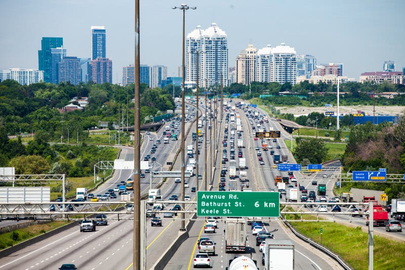 View from an Overpass of the 401 Highway with Toronto City in Ba ...