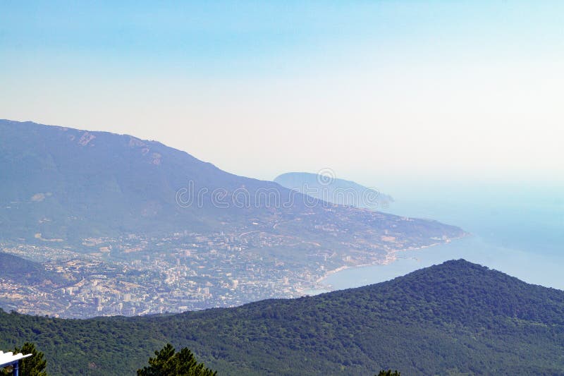 View from the peak of Mount Ai-Petri on the slopes of the mountains and the Black Sea coast. Crimea stock photos View from the peak of Mount Ai-Petri on the slopes of the mountains and the Black Sea coast. Crimea stock photos