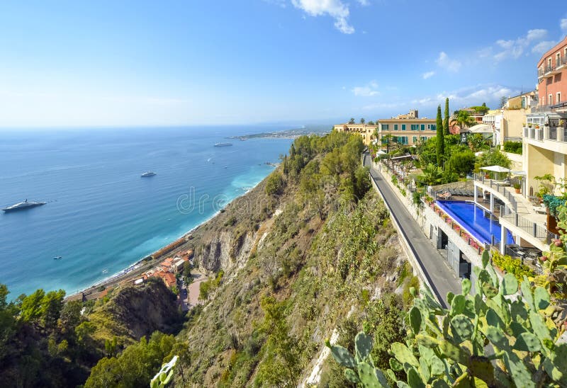 View from Piazza Aprile in the historic center of Taormina, Italy, on the island of Sicily, of the Mediterranean Sea, ships, reso royalty free stock photo View from Piazza Aprile in the historic center of Taormina, Italy, on the island of Sicily, of the Mediterranean Sea, ships, reso royalty free stock photo