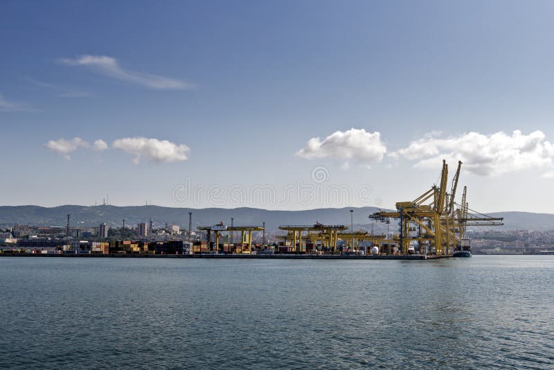 View of Pier VII of the Port of Trieste with cranes for loading:unloading containers royalty free stock photography