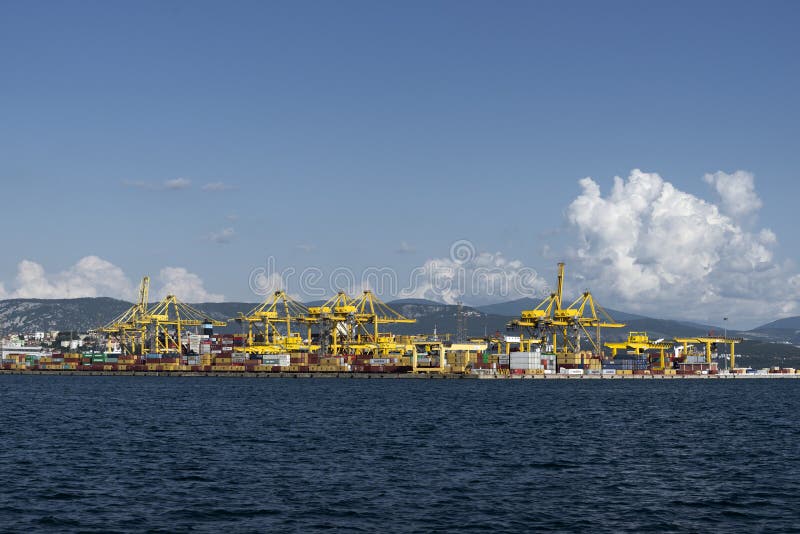 View of Pier VII of the Port of Trieste with cranes for loading:unloading containers stock image