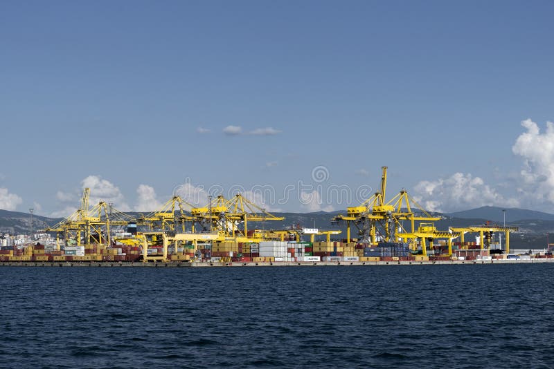 View of Pier VII of the Port of Trieste with cranes for loading:unloading containers stock photos