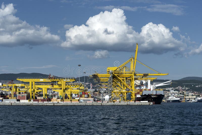 View of Pier VII of the Port of Trieste with cranes for loading:unloading containers stock image