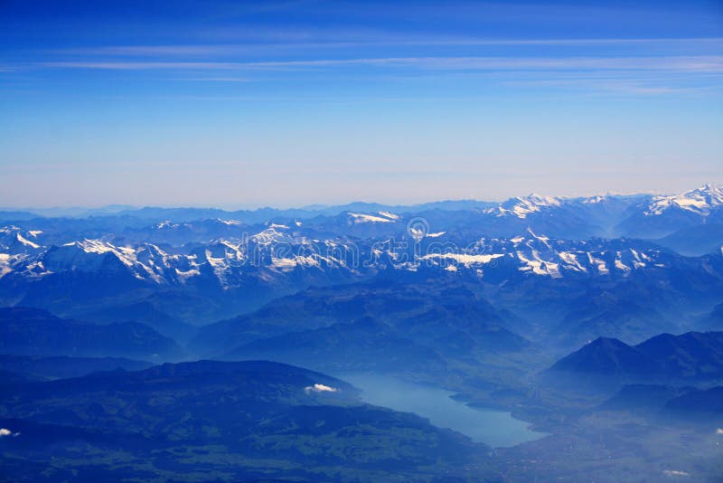 Aerial view on a landscape with Alps and a lake. Aerial view on a landscape with Alps and a lake