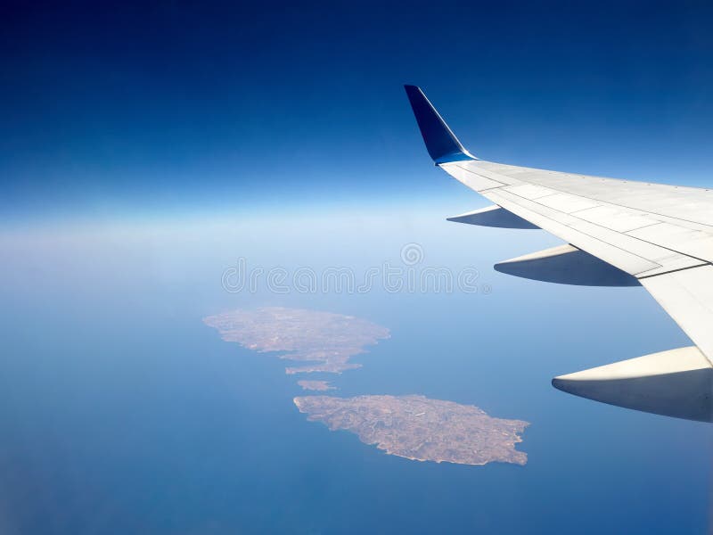 View through the porthole of the plane to the island of Malta.