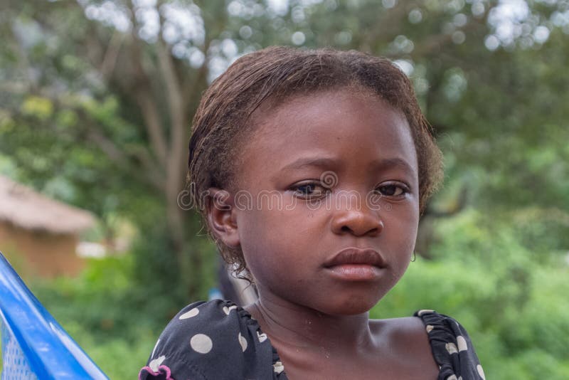 View of a Portrait of an African Girl, Child with Expressive Sad Look on  Her Face Editorial Stock Photo - Image of angola, centralized: 174142378