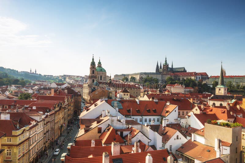 View of Prague rooftops, St. Vitus Cathedral and St. Nicholas Cathedral. Czech republic