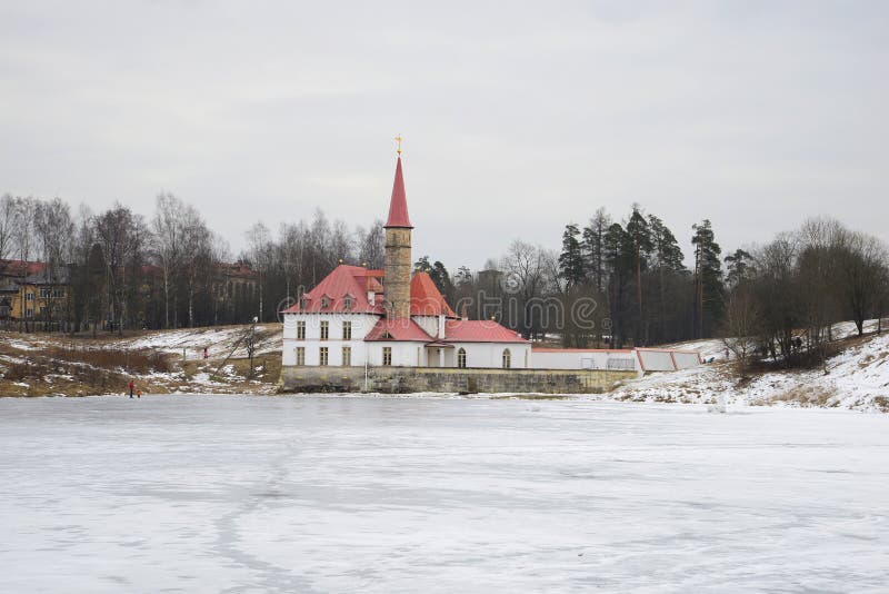 View of Priory Palace on the Black lake on a cloudy afternoon. Gatchina