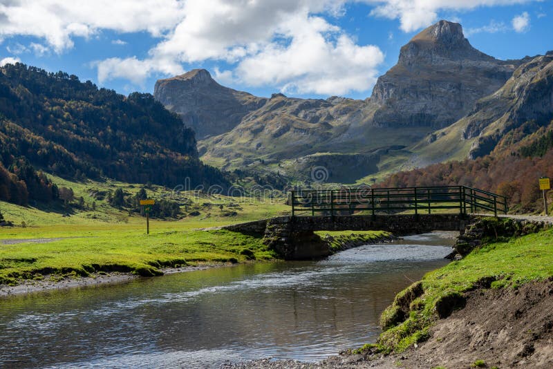 View of Pyrenees Mountains with Small River Near Pic Ossau Stock Image