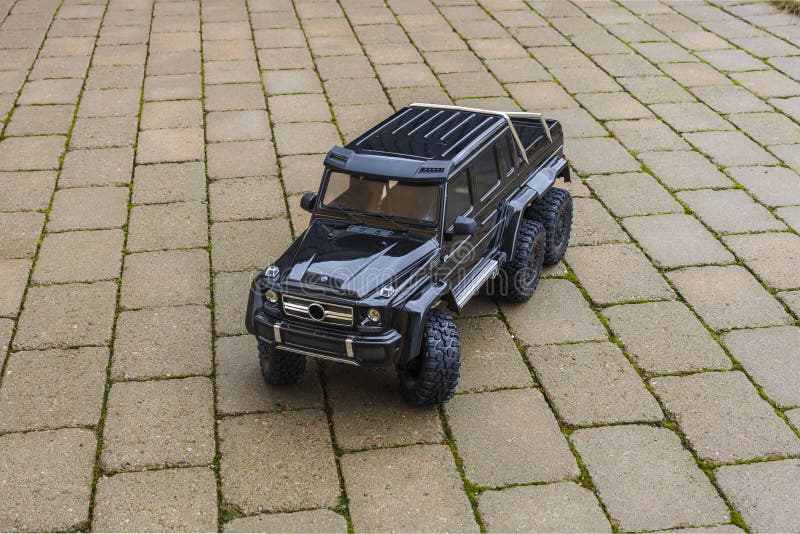 View of radio controlled model  racing car on off-road background. Toys with remote control. Free time.