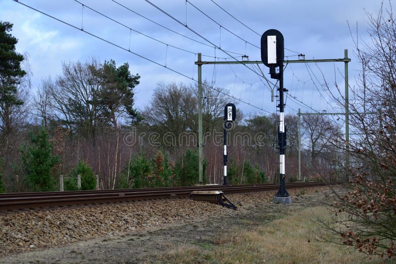 View of Rails and Signal Posts from beside a Train Track in the Netherlands Stock Image Image