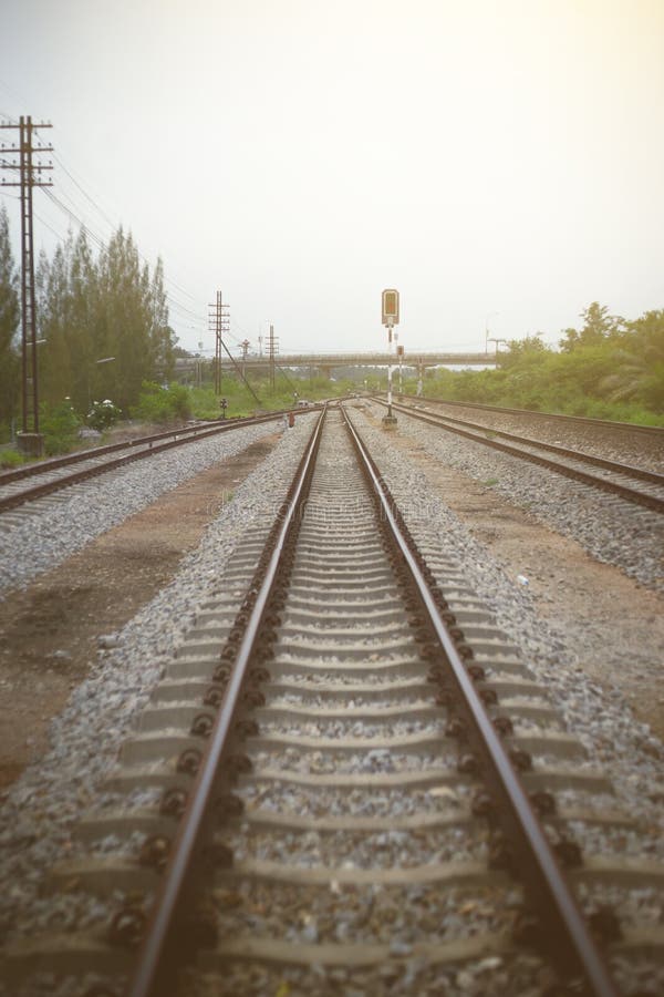 View of railway with green tree at left and right side of railway,filtered image, light effect added, selective focus royalty free stock images View of railway with green tree at left and right side of railway,filtered image, light effect added, selective focus royalty free stock images