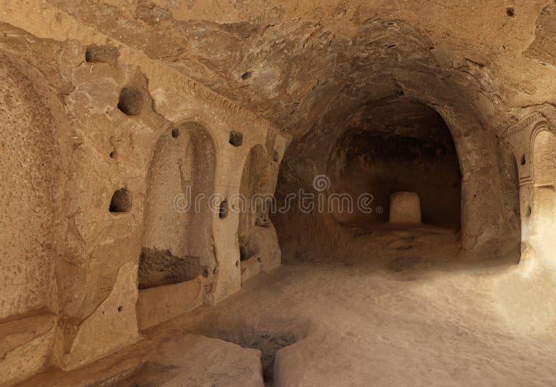 View of the ruins of the premises of the ancient prayer room in the caves of the old sandstones in the valleys of Cappadocia royalty free stock images View of the ruins of the premises of the ancient prayer room in the caves of the old sandstones in the valleys of Cappadocia royalty free stock images