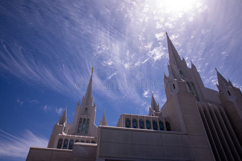 San Diego, California \ USA - 06 September 2019: View at San Diego California Temple of The Church of Jesus Christ of Latter-day Saints. Bright white building against blue sky with white clouds