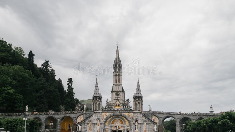 Sanctuary of Our Lady of Lourdes Under Clouds, in Lourdes, France Stock ...