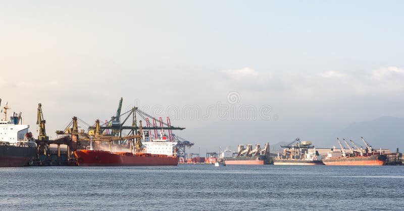 View of Santos Port Canal with anchored ships being loaded stock images View of Santos Port Canal with anchored ships being loaded stock images