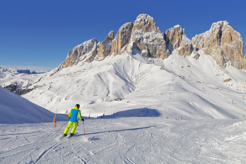 View of the Sassolungo Langkofel Group of the Italian Dolomites in Winter from the Val di Fassa Ski Area, Sella Ronda, Sella Group, Trentino-Alto-Adige region, Italy. View of the Sassolungo Langkofel Group of the Italian Dolomites in Winter from the Val di Fassa Ski Area, Sella Ronda, Sella Group, Trentino-Alto-Adige region, Italy