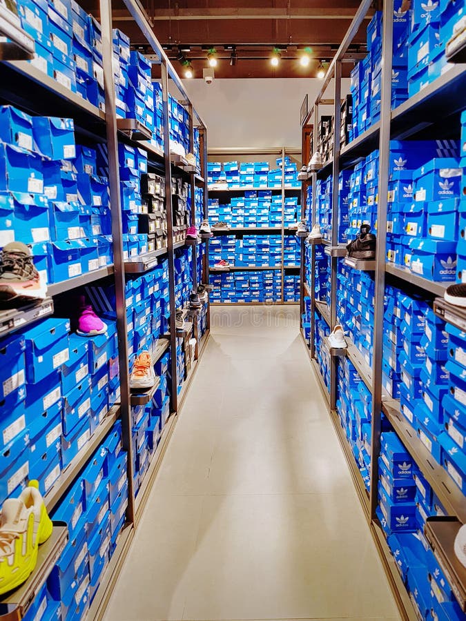 View between Shelves of Blue Shoes Boxes at Adidas Store Editorial ...