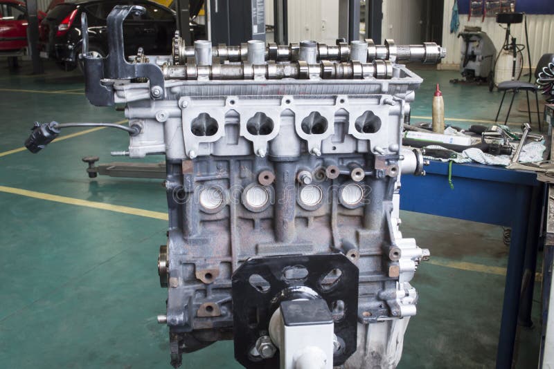 View from the Side of the Intake Manifold Mounting on a Partially Disassembled Car Engine