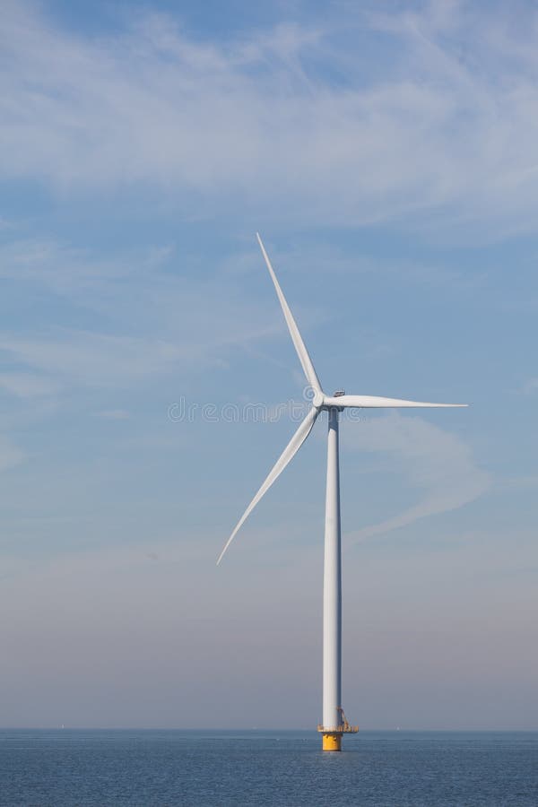 View of single windturbine in the Dutch Noordoostpolder, Flevoland and the IJsselmeer, near the town of Urk.