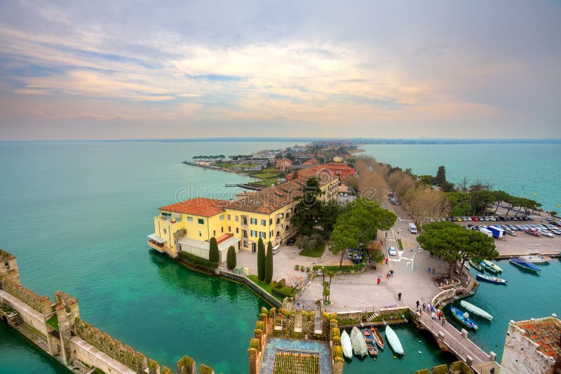 View on Sirmione and Lake Garda fro the castle. Aerial view from Scaglieri castle on Lake Garda and town of Sirmione in Italy stock photos View on Sirmione and Lake Garda fro the castle. Aerial view from Scaglieri castle on Lake Garda and town of Sirmione in Italy stock photos