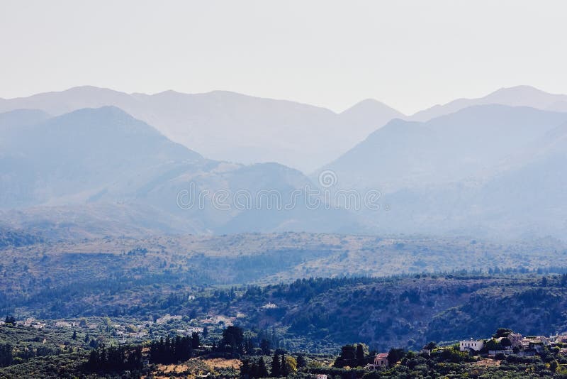 View of small Greek village surrounded by mountains, Crete, Greece stock photo View of small Greek village surrounded by mountains, Crete, Greece stock photo