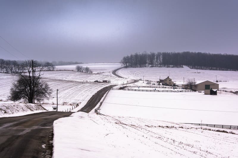 View of snow covered hills and fields in rural York County, Penn