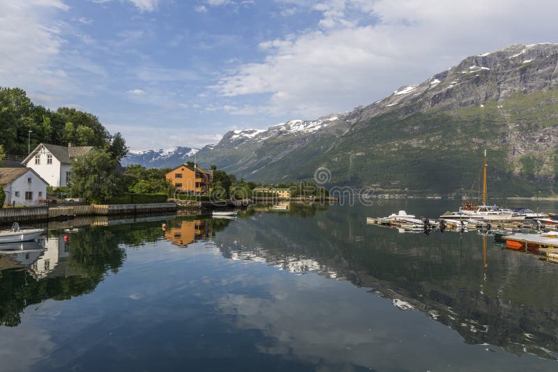 View of Sor fjord from Lofthus with a beautiful reflection of mountains in the background