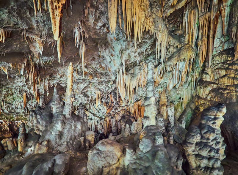 View of stalactites and stalagmites in an underground cavern - Postojna cave in Slovenia royalty free stock photography View of stalactites and stalagmites in an underground cavern - Postojna cave in Slovenia royalty free stock photography