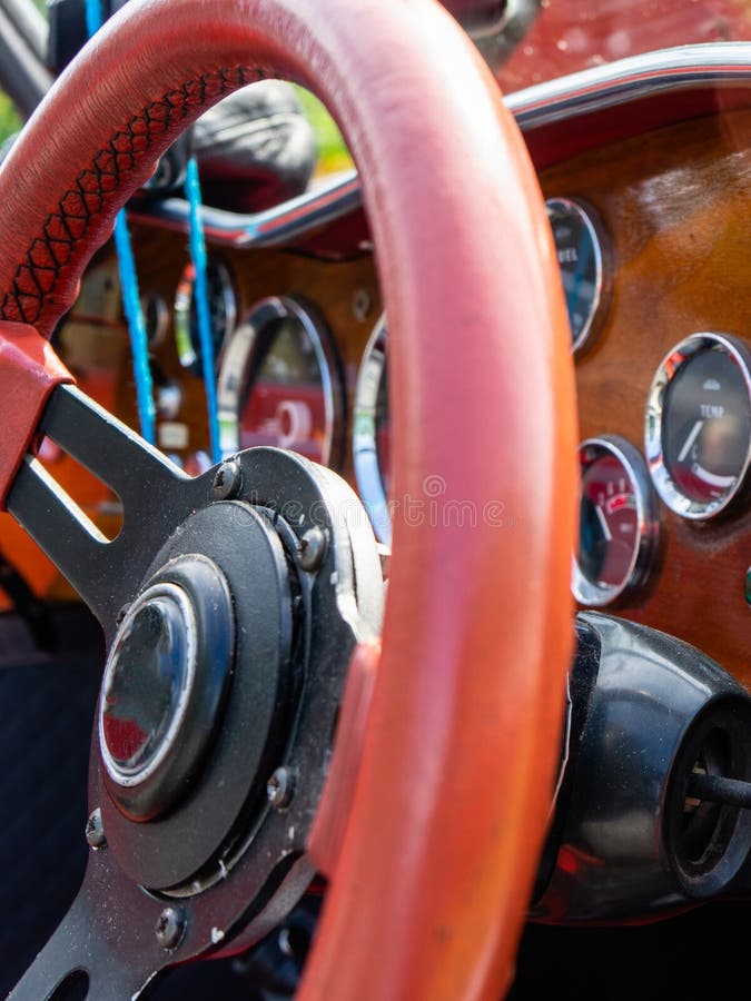 View of the Steering Wheel and Dashboard of an Old Vintag Car Stock