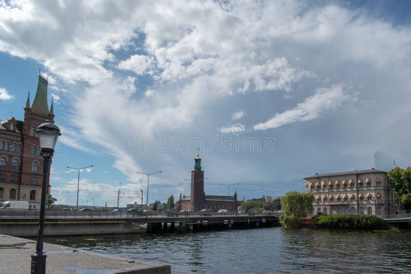 View of Stockholm city hall, Strömsborg Island and the Norstedt house. To the left is the Norstedt house on Riddarholmen island of Gamla stan - the old town of royalty free stock image View of Stockholm city hall, Strömsborg Island and the Norstedt house. To the left is the Norstedt house on Riddarholmen island of Gamla stan - the old town of royalty free stock image