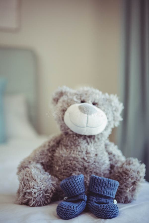 View of Teddy Bear and Baby Socks Stock Image Image of home, domestic