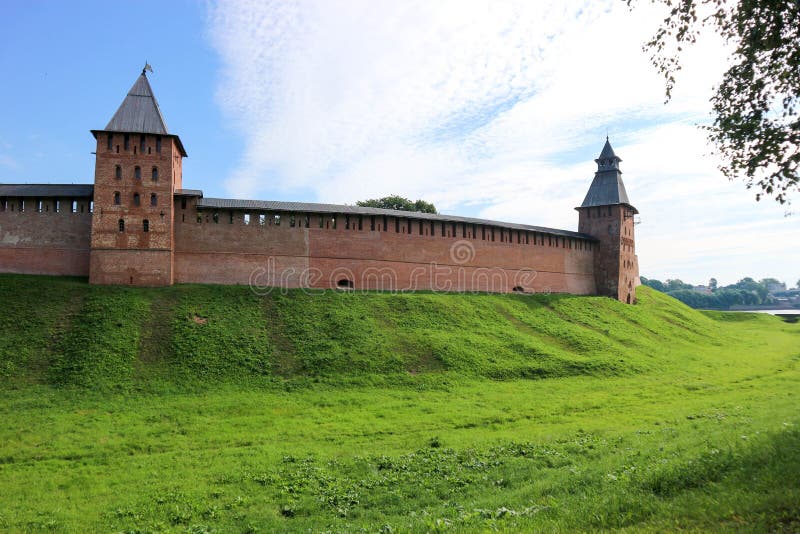 View to the wall and towers of the Velikiy Great Novgorod citadel kremlin, detinets in Russia under blue summer sky in the mor