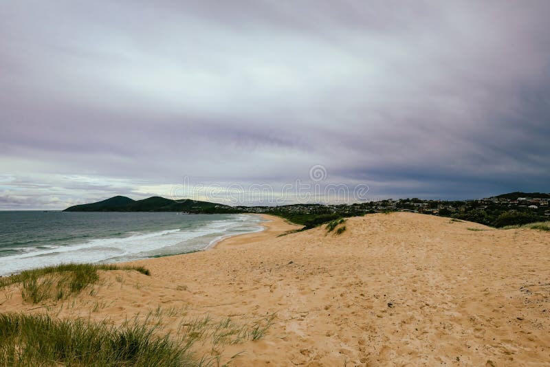 View from top of the sand dune at One Mile Beach, Forster NSW Australia