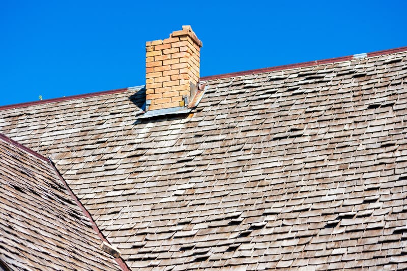 View Of Traditional Wooden Shingle Roof With A Few Weathered Shakes