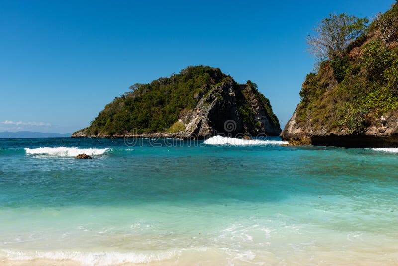 View of Tropical Beach, Sea Rocks and Turquoise Ocean, Blue Sky. Atuh