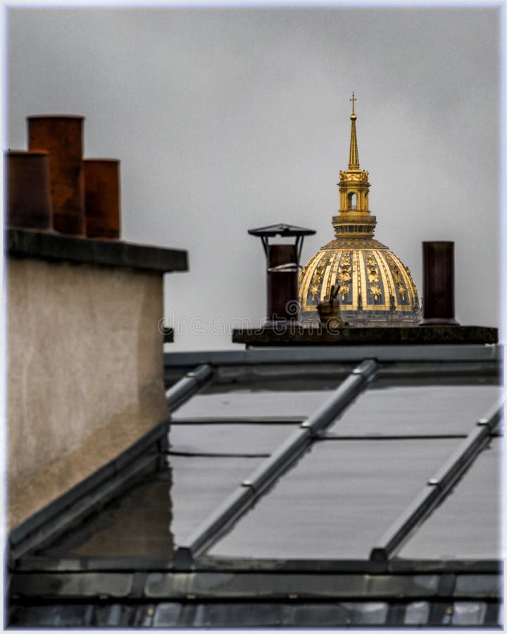 A view from the window in Paris, France. Wet roofs after the rain and the Les Invalides house at the background. A view from the window in Paris, France. Wet royalty free stock photos A view from the window in Paris, France. Wet roofs after the rain and the Les Invalides house at the background. A view from the window in Paris, France. Wet royalty free stock photos