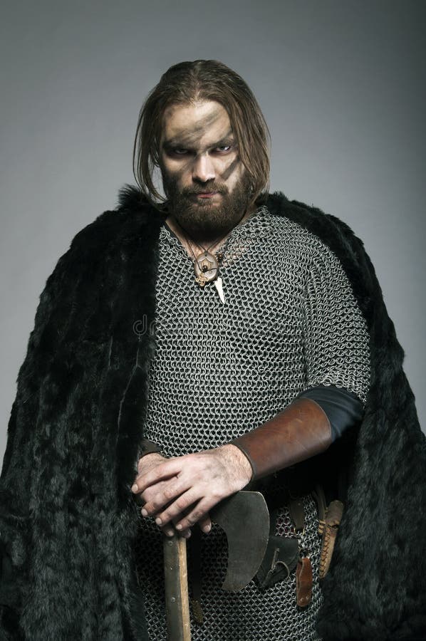 Viking in Fur Standing Leans on His Axe on the Grey Background Stock ...