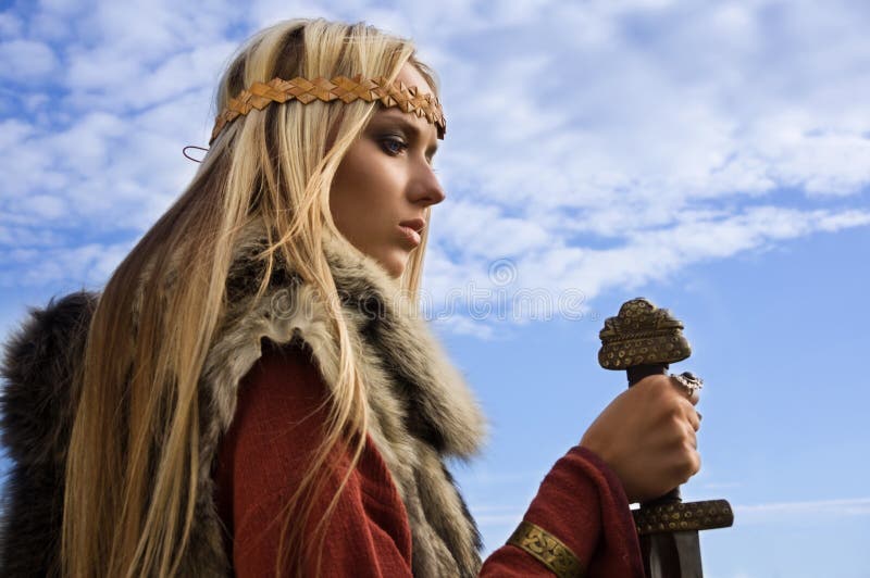 Viking girl on a blue sky background