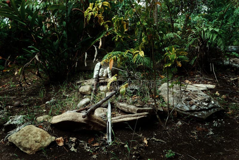 Walarano village, Malekula Island / Vanuatu - 9 JUL 2016 : magical stones and other holy artifacts at a sacred burial site. Walarano village, Malekula Island / Vanuatu - 9 JUL 2016 : magical stones and other holy artifacts at a sacred burial site.